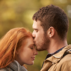 Image showing Couple, forehead kiss and outdoor for love, romance and passion for romantic, dating and relationship together. Boyfriend, girlfriend and young people with eyes closed for happy and care in park