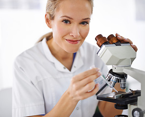 Image showing Woman, portrait and rmedical research scientist with microscope for exam or scientific discovery at laboratory. Face of female person or expert with smile and scope for breakthrough or biology