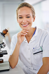 Image showing Happy woman, portrait and scientist with microscope for biology, science or chemistry at clinic. Face of female person or medical professional with smile in confidence for healthcare research or exam