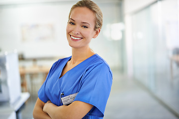 Image showing Happy woman, portrait and professional nurse with confidence for healthcare or science at hospital. Young female person or medical doctor with smile and arms crossed for PHD or career ambition at lab