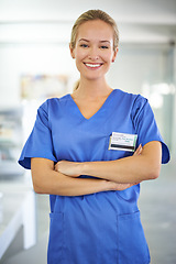 Image showing Happy woman, portrait and professional nurse with career ambition or confidence for healthcare or science at hospital. Young female person or medical doctor with smile and arms crossed for PHD at lab