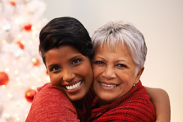 Image showing Senior mother, daughter and hug on Christmas in portrait, happiness with gratitude and love to celebrate holiday. Trust, support and care with women at xmas party in the home, family and bonding