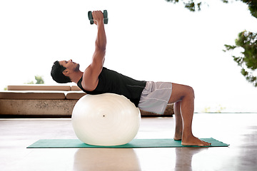 Image showing Man, dumbbell and exercise ball on yoga mat or flexibility training for healthy mobility, fitness or weightlifting. Male person, equipment and workout strength for sport challenge, gym or balance