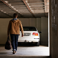 Image showing Parking, garage and man travel in car for morning commute or transportation for vacation on holiday. Luggage, bag and person with motor journey to work or walking in underground lot to parked vehicle