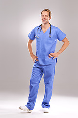 Image showing Hospital, doctor and portrait of man on a white background for medical service, consulting and wellness. Healthcare, clinic and isolated health worker with confidence, pride and stethoscope in studio