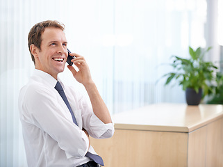 Image showing Office, networking and happy man with phone call, negotiation for communication and planning deal. Discussion, consulting and businessman with smartphone, smile and connection with advisory service