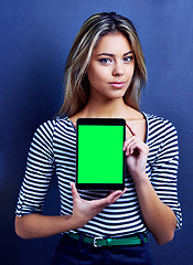 Image showing Woman, tablet and green screen with space, studio and portrait for mockup with presentation by blue background. Business person, entrepreneur and show ui on digital touchscreen with chromakey for app