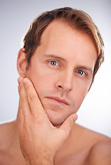 Image showing Man, portrait and skincare dermatology in studio for healthy hygiene for cosmetic treatment, cleaning or white background. Male person, face and model or touching wellness, routine or mockup space