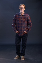 Image showing Happy, nerd and portrait of man in studio with fashion and pride in style on dark background. Confident, geek and casual hipster person with glasses smile in mockup space to relax with happiness