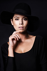 Image showing Woman, fashion and hat in portrait with beauty, mob or classic gangster style on black background. Confidence, stylish with accessory and skin glow, fedora for vintage trend and designer in studio