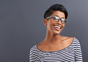 Image showing Woman, portrait and smile with glasses of creative employee with grey background ready for work. Job, inspiration and happy Indian worker with fashion designer confidence and mockup space with style