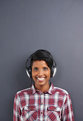 Image showing Headphone, woman and portrait for gadget, audiobook and sound for listen or hear for podcast. Young person and smile in studio for radio, streaming and waves for volume, loud and speaker for track