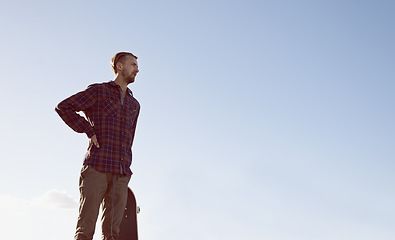 Image showing Skateboard, thinking and man at a skate park with idea for trick, stunt or adrenaline sports on blue sky background. Planning, calm and male skateboarder with reflection, questions or memory on ramp