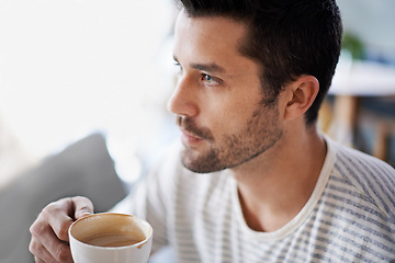 Image showing Coffee, thinking and man with drink in restaurant, cafeteria and diner for breakfast, wellness and break. Person with idea, thoughtful and wondering with beverage, caffeine and cappuccino in morning