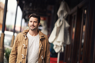 Image showing Man, face and smile by cafe in city with fashion or urban style, trendy outfit or confidence by restaurant. Male person, happy pr walking outdoor in town with wellness, casual clothes or morning trip