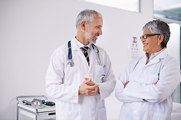 Image showing Teamwork, optometry and doctors in hospital for discussion, insurance and meeting. Healthcare, optician and man and woman in conversation, talking and chat for medical care, eye care and consulting