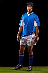 Image showing Ball, man and portrait for rugby, sport and active for game, fitness and sportswear on grass or field. Young person, athlete or player and confident with kit for fit, competitive and recreation