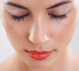 Image showing Woman, beauty and makeup in studio for cosmetics, dermatology and eyelash extension on a white background. Closeup, face and model or person with foundation, skincare and her eyes closed for results