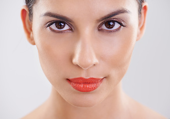 Image showing Woman, portrait and makeup in studio for cosmetics, dermatology and skin care on a white background. Closeup, face and model or young person with facial foundation and confidence with beauty results