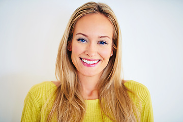 Image showing Smile, portrait and woman in a house with confidence, positive attitude and feel good mood on white wall background. Face, happy and female person at home with optimism, relax and chilling on weekend