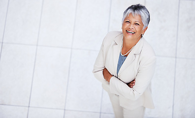 Image showing Business, portrait and high angle of woman with arms crossed in office with professional confidence and pride. Above, entrepreneur and happy mature person in lobby excited for morning at workplace