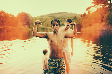 Image showing Portrait, teenager and flex with nature, lake and friends with happiness and bonding together. People, outdoor and boys in water, environment and chilling with vacation and holiday with adventure