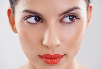 Image showing Woman, beauty and thinking in studio of makeup, dermatology and skin care on a white background. Closeup and face of a young model or person with facial foundation and inspiration or cosmetics ideas