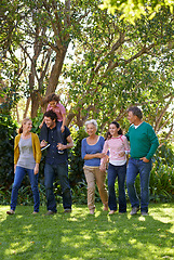Image showing Happy family, conversation and together in outdoor nature, love and bonding or relax in backyard. Generations, smile and peace or communication for support in garden or park, vacation and holiday