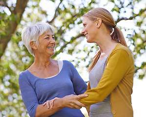 Image showing Senior woman, mother and daughter with embrace for bonding, affection and love to relax in garden, backyard and nature. Female people, family and women with smile, happiness and together outdoor