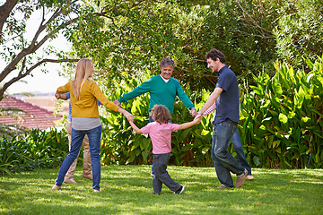 Image showing Happy family, holding hands and children dance outdoor or play game in summer together in circle with grandparents. Ring a rosy, smile and kids in garden on holiday, vacation and bonding with parents