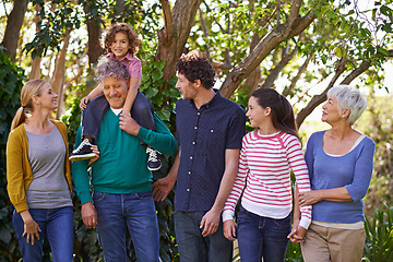 Image showing Happy family, conversation and bonding in outdoor nature, love and talking or relax in backyard. Generations, smile and peace or communication for support in garden or park, vacation and holiday