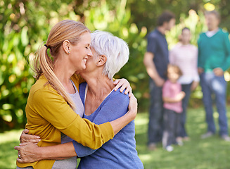 Image showing Hug, family and women with love for bonding, affection and embrace to relax in garden, backyard and nature. Female people, mother and daughter with smile, happiness or together outdoor with relatives