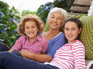 Image showing Relax, grandmother and children in a garden, portrait and happiness with vacation and weekend break. Face, smile and outdoor with granny and cheerful with holiday and bonding together with grandkids