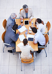 Image showing Coworkers, collaboration and table for meeting, discussion and profession with tablet and documents for teamwork. Business people or colleagues and sitting with tech for planning and brainstorm