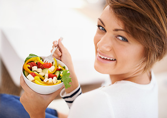 Image showing Woman, salad and happy portrait with eating food for diet, detox and breakfast on sofa at home. Person relax and healthy vegetables, tomato and green or vegan meal in bowl for nutrition and wellness