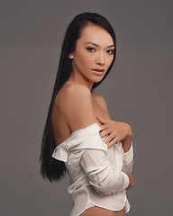 Image showing Portrait, shirt and beauty with woman, fashion and confident girl on a grey studio background. Face, person and model with stylish lingerie and mockup space with pride, aesthetic and casual outfit