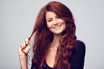 Image showing Ginger, beauty and woman with hair care for red color in studio, background and mockup. Cosmetics, dye and happy portrait of girl with natural shine, healthy hairstyle or skincare on face with makeup