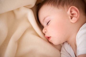 Image showing Baby, sleeping and tired in a home relax with nap in nursery with peace in a bed with blanket. Morning, youth and kid with dream of an infant with child development from rest in bedroom with newborn