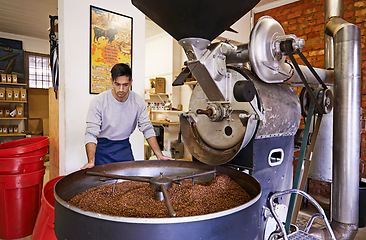 Image showing Coffee, checking and man with machine for roasting with small business, production and quality control. Entrepreneur, barista or roaster with beans at cafe, sustainable startup and espresso process