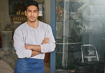 Image showing Barista, cafe and man in portrait for small business, owner with arms crossed and confident for service. Entrepreneur, coffee shop and drinks for hospitality, professional and server in industry