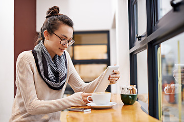 Image showing Woman, coffee shop and tablet with freelancer work and social media in cafe with cappuccino. Website, hot drink and internet with digital blog writer and technology at restaurant with tea and reading