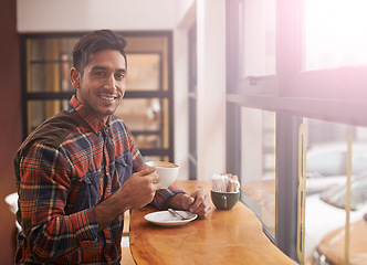 Image showing Happy man, portrait and cafe with coffee by window for morning, breakfast or start of the day. Male person with smile, drink or beverage in relax for caffeine, mug or cup of tea at indoor restaurant
