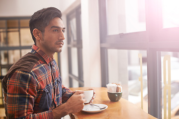Image showing Serious man, thinking and window with coffee for morning, breakfast or vision at indoor cafe. Young male person in wonder or thought with drink, mug or beverage for caffeine or tea at restaurant