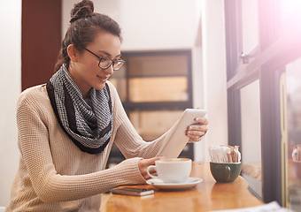 Image showing Woman, coffee shop and tablet reading with creative freelancer work and social media in cafe. Website, drink and internet with digital blog writer and technology at restaurant with tea and lens flare