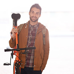 Image showing Man, portrait and bike for travel with transport, carbon footprint and sustainable commute for environment. Bicycle for eco friendly journey, cycling and happy with rider, workout and wellness