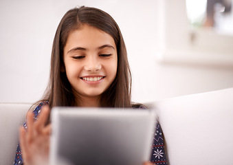 Image showing Relax, couch or happy child with tablet for elearning, playing games or streaming videos on a movie website. Education, online and girl in home with technology to download on app or reading ebook