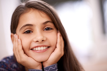 Image showing Girl, child and smile in home with closeup, portrait or headshot on break, vacation or morning in youth. Kid, happy and relax with pride, growth or development with fashion at family house in Madrid