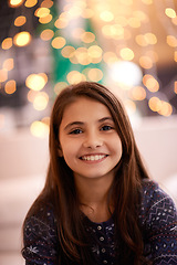 Image showing Home, happy and portrait of child with lights for relaxing, resting and calm in bedroom at night. Youth, smile and face of young girl with fairy light for childhood memory, playing and happiness