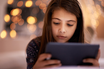 Image showing Home, night or kid with tablet for streaming, playing games or watching fun videos on movie website. Girl, house or young female child with technology to download online or social media app to relax