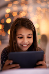 Image showing Home, night or girl with tablet for movies, playing games or watching funny videos on streaming website. Happy, house or child with smile technology to download online or social media app to relax